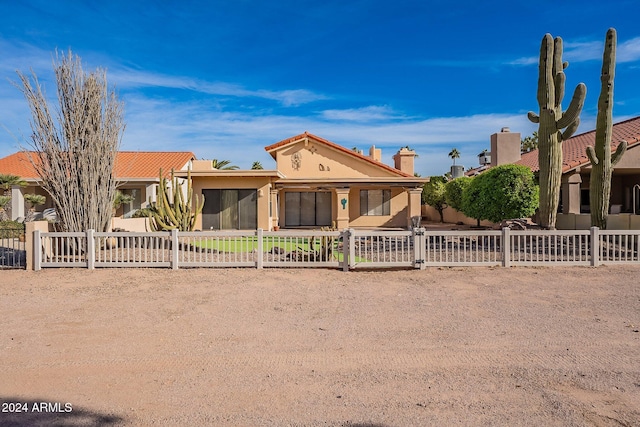 view of front of property featuring a sunroom