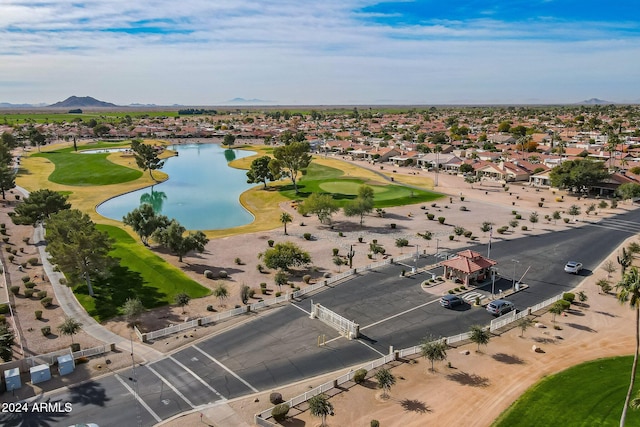 drone / aerial view featuring a water and mountain view