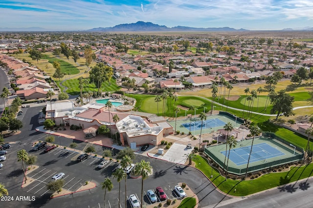 birds eye view of property with a mountain view