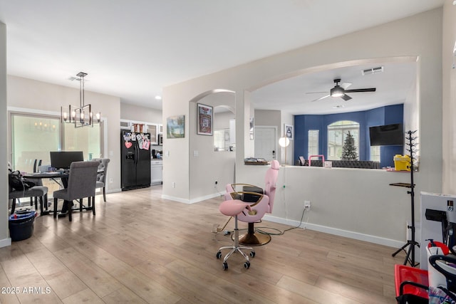 interior space with ceiling fan and light wood-type flooring