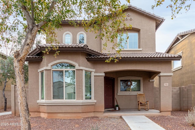 mediterranean / spanish-style home with a patio