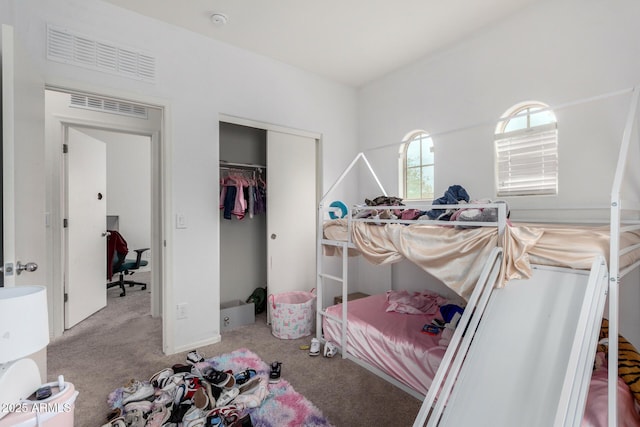 carpeted bedroom with a closet