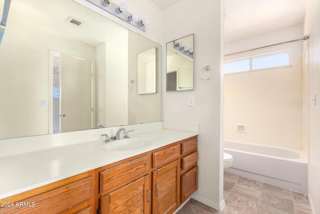 bathroom featuring visible vents, vanity, and toilet