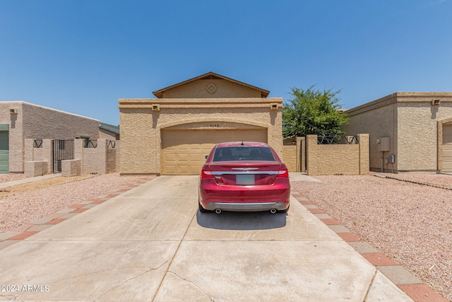 view of front of property with a garage