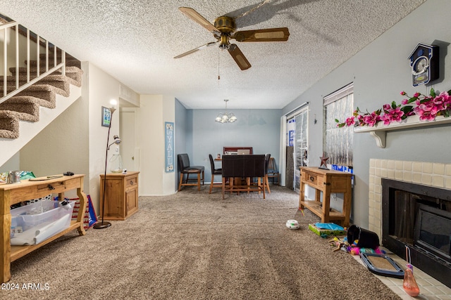 carpeted dining space featuring a textured ceiling and ceiling fan with notable chandelier