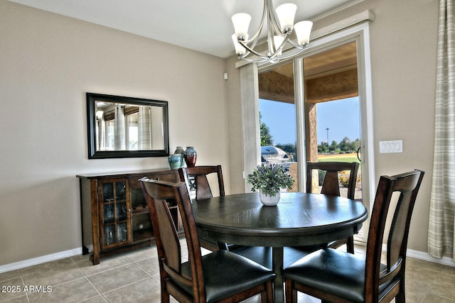 dining room featuring light tile patterned flooring and a chandelier