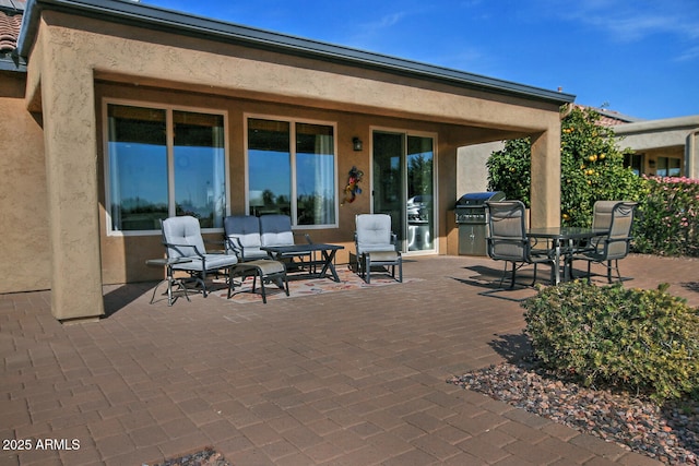 view of patio / terrace featuring an outdoor living space and grilling area