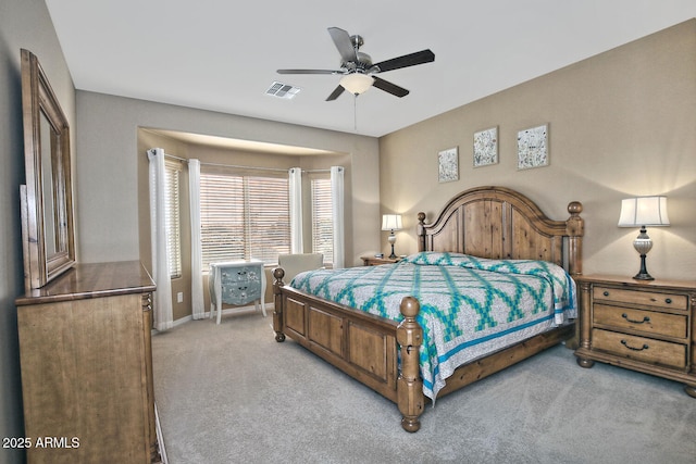 bedroom with light colored carpet and ceiling fan