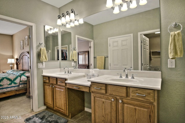 bathroom with tile patterned flooring and vanity