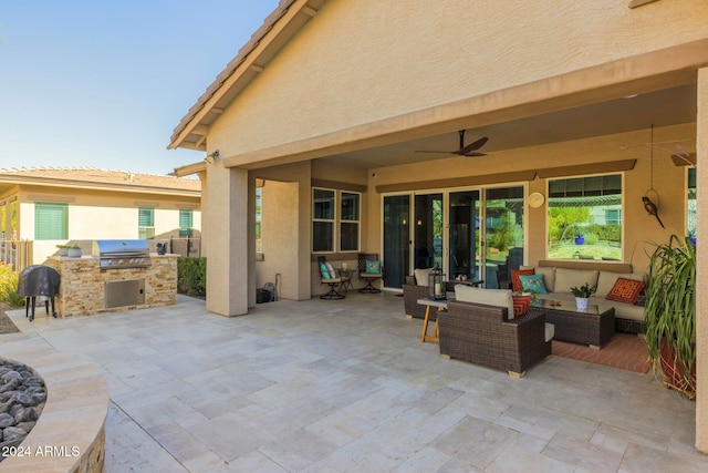 view of patio / terrace featuring an outdoor hangout area, ceiling fan, an outdoor kitchen, and a grill