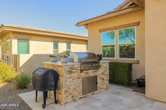 view of patio / terrace with an outdoor kitchen and grilling area