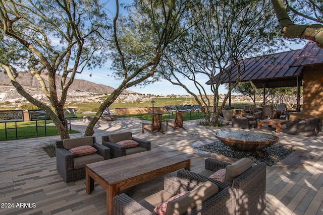 view of patio / terrace with a mountain view and an outdoor hangout area