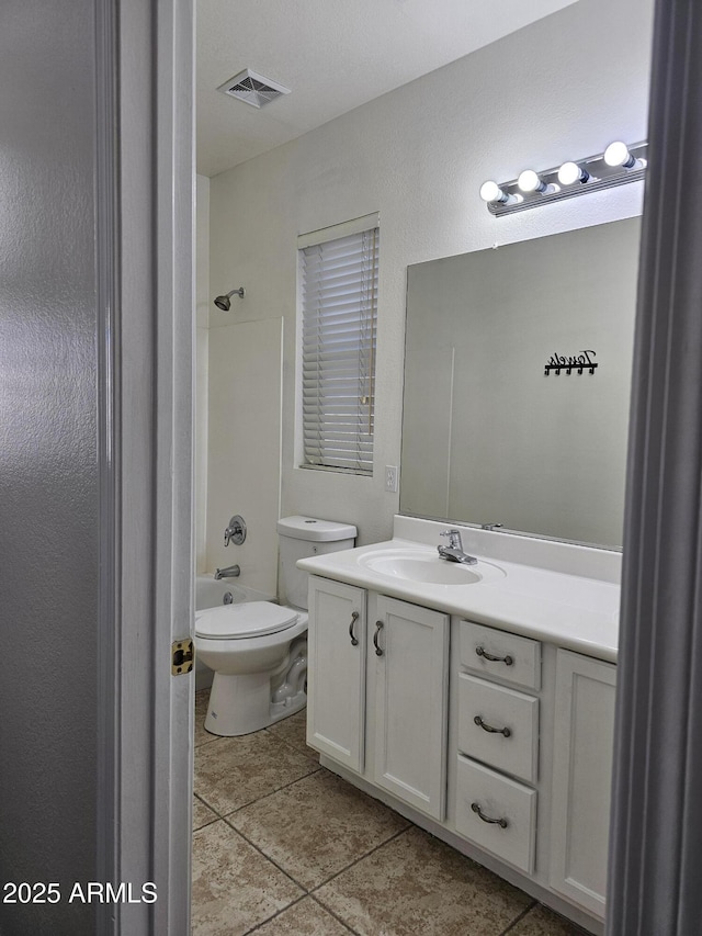 bathroom featuring visible vents, toilet, vanity, tile patterned flooring, and shower / bathtub combination