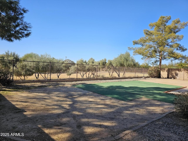 view of sport court with a fenced backyard