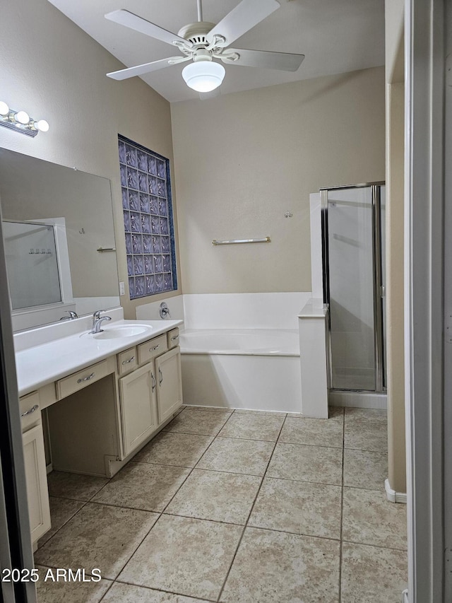 full bathroom featuring vanity, ceiling fan, tile patterned flooring, a shower stall, and a garden tub