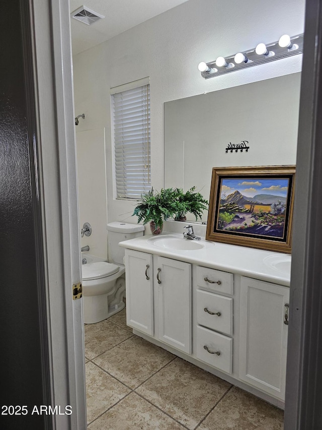 full bathroom with vanity, toilet, visible vents, and tile patterned flooring