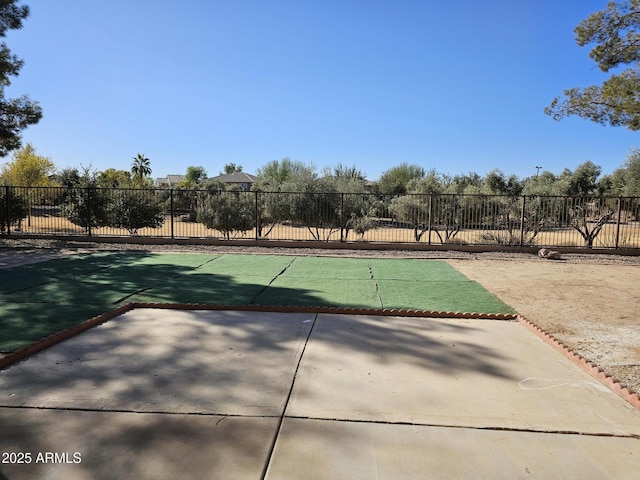 view of community featuring a patio and fence