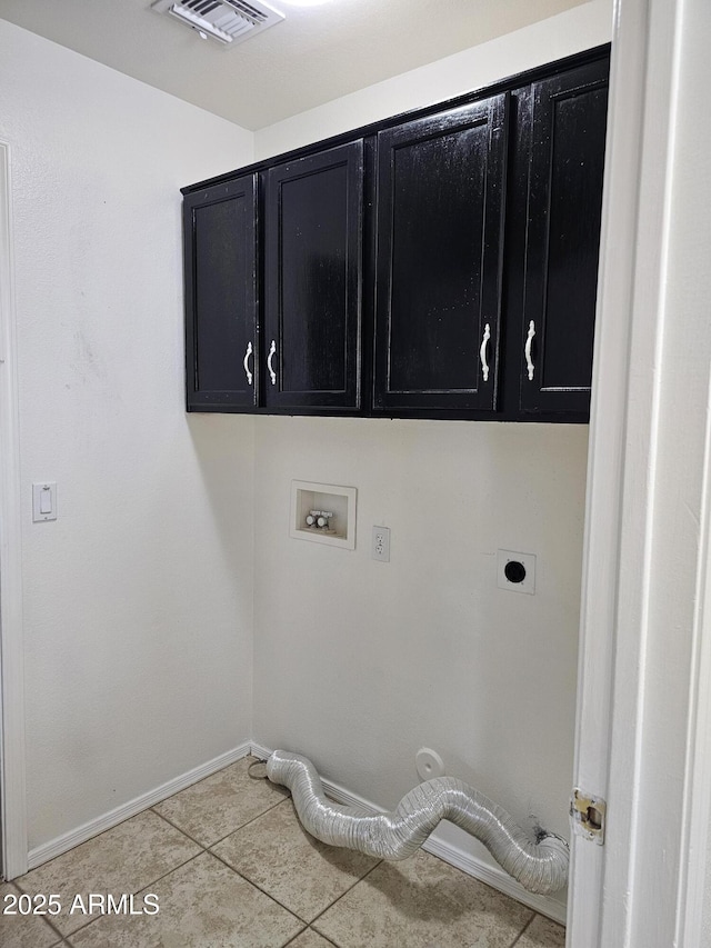 clothes washing area featuring electric dryer hookup, visible vents, cabinet space, light tile patterned floors, and hookup for a washing machine