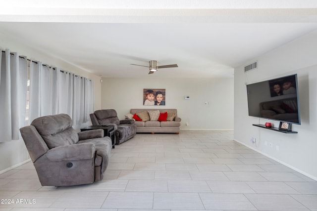 living room featuring ceiling fan and light tile patterned floors