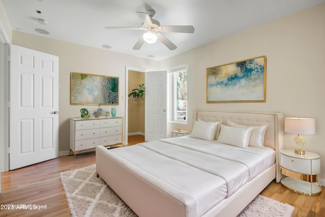 1342 W Emerald Ave Unit 286, Mesa, AZ 85202 - bedroom featuring light wood-style floors, baseboards, and ceiling fan