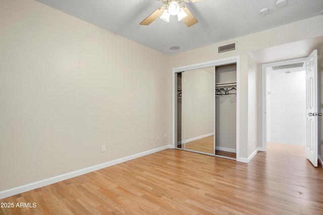 1342 W Emerald Ave Unit 286, Mesa, AZ 85202 - unfurnished bedroom featuring light wood finished floors, a closet, baseboards, and a ceiling fan