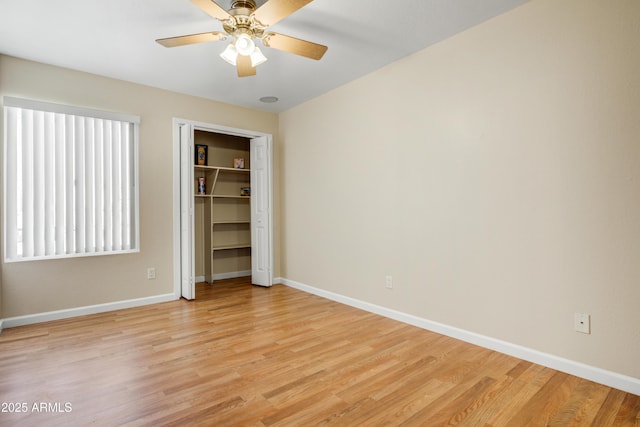 1342 W Emerald Ave Unit 286, Mesa, AZ 85202 - unfurnished bedroom with light wood-type flooring, baseboards, a closet, and ceiling fan