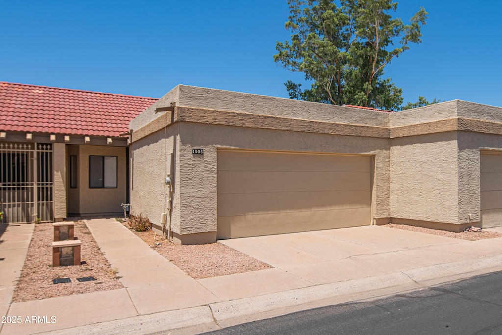 1506 N Oak St, Tempe, AZ 85288 - view of front of home with stucco siding, a garage, driveway, and a tile roof