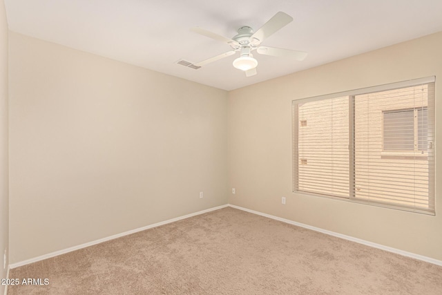 15011 W Verde Ln, Goodyear, AZ 85395 - carpeted spare room with baseboards and ceiling fan