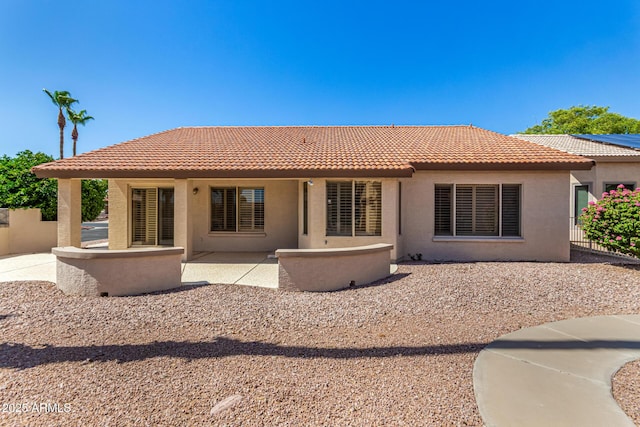 15011 W Verde Ln, Goodyear, AZ 85395 - rear view of house with stucco siding, a tiled roof, and a patio area