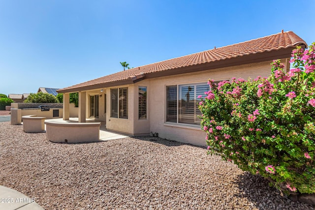 15011 W Verde Ln, Goodyear, AZ 85395 - back of house featuring a tile roof, a patio, and stucco siding