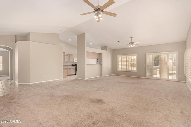 15011 W Verde Ln, Goodyear, AZ 85395 - unfurnished living room with a ceiling fan, light carpet, arched walkways, high vaulted ceiling, and light tile patterned flooring