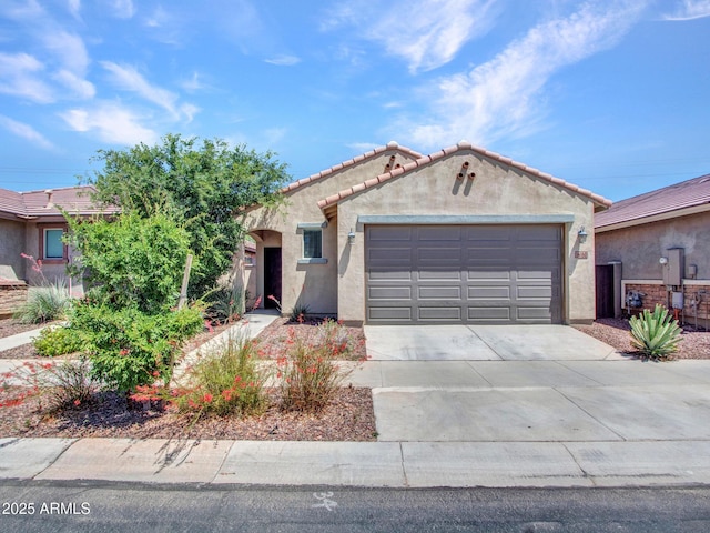 14160 W Georgia Dr, Surprise, AZ 85379 - mediterranean / spanish-style house featuring driveway, stucco siding, an attached garage, and a tiled roof