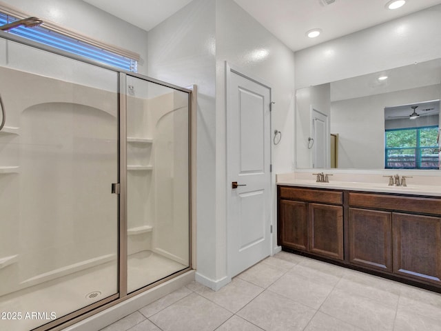 14160 W Georgia Dr, Surprise, AZ 85379 - bathroom featuring tile patterned floors, a stall shower, double vanity, and recessed lighting