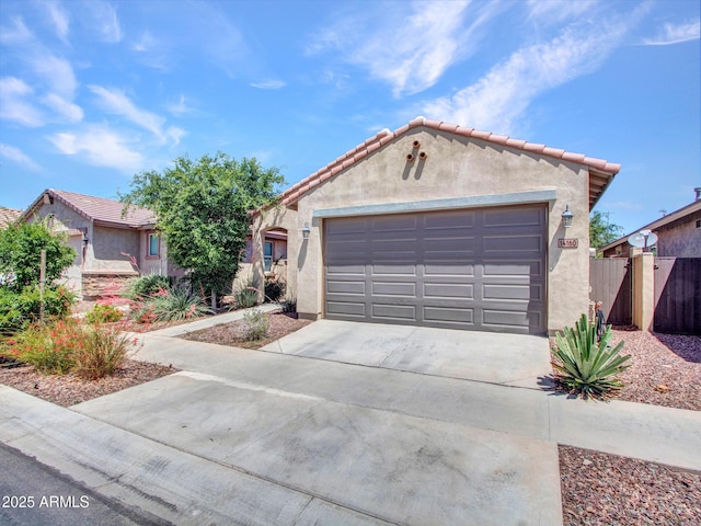 14160 W Georgia Dr, Surprise, AZ 85379 - view of front of property featuring stucco siding, a garage, concrete driveway, and a tiled roof