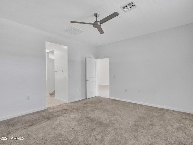14160 W Georgia Dr, Surprise, AZ 85379 - unfurnished bedroom featuring light colored carpet, baseboards, ensuite bath, and a ceiling fan