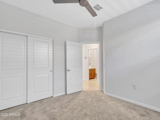 14160 W Georgia Dr, Surprise, AZ 85379 - unfurnished bedroom with light colored carpet, baseboards, a closet, and a ceiling fan