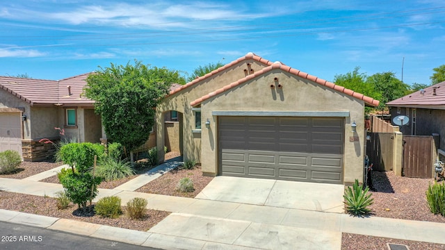 14160 W Georgia Dr, Surprise, AZ 85379 - view of front of property featuring stucco siding, driveway, an attached garage, and a tile roof