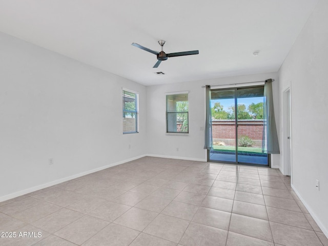 14160 W Georgia Dr, Surprise, AZ 85379 - empty room with ceiling fan, light tile patterned flooring, and baseboards