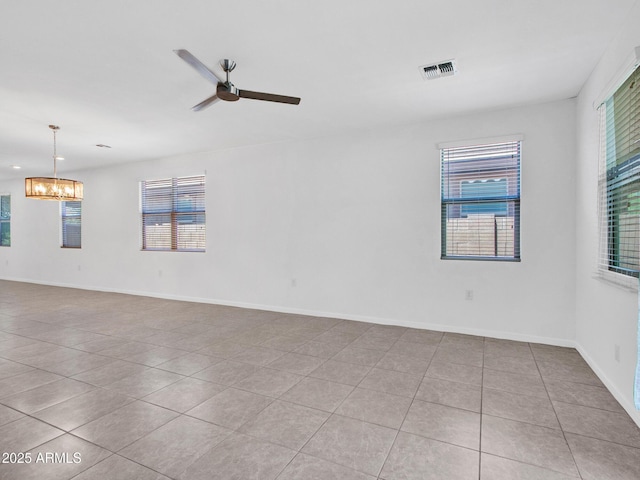 14160 W Georgia Dr, Surprise, AZ 85379 - tiled empty room featuring a chandelier, plenty of natural light, a ceiling fan, baseboards, and recessed lighting