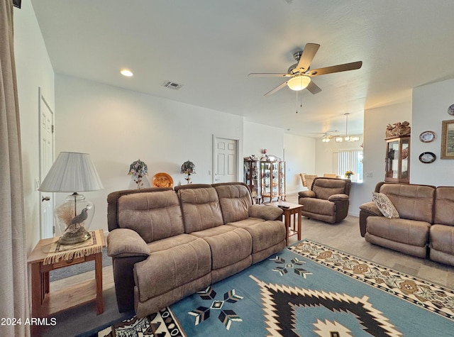 living room with ceiling fan and carpet floors