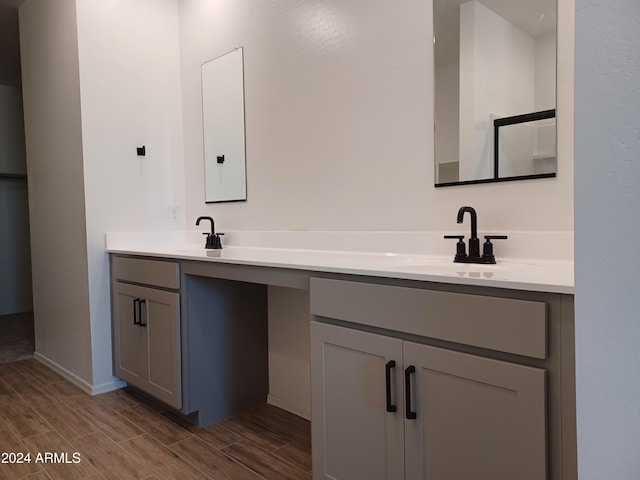 bathroom with hardwood / wood-style floors and vanity