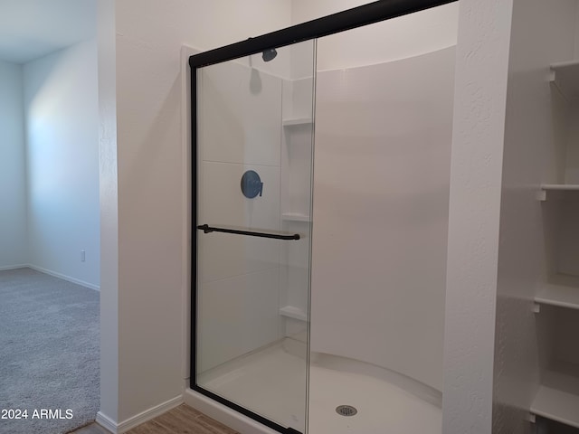 bathroom featuring an enclosed shower