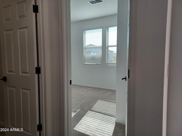 hallway with light carpet