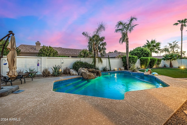 view of swimming pool with a lawn, a patio area, a fenced backyard, and a fenced in pool