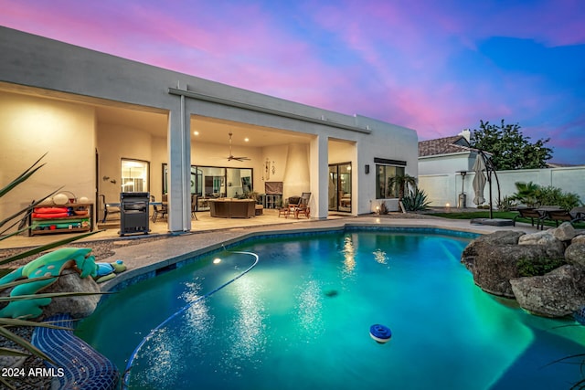 view of pool with ceiling fan, outdoor dining area, an outdoor hangout area, a fenced in pool, and a patio area