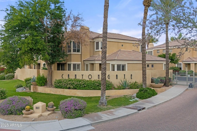 7887 N 16th St Unit 226, Phoenix, AZ 85020 - view of front facade featuring stucco siding and a tile roof
