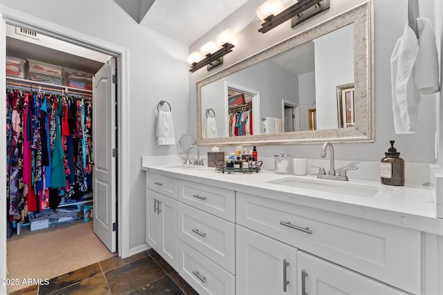 7887 N 16th St Unit 226, Phoenix, AZ 85020 - bathroom with double vanity and a spacious closet