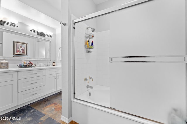7887 N 16th St Unit 226, Phoenix, AZ 85020 - full bath with stone tile flooring, shower / bath combination with glass door, and vanity