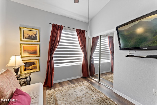 7887 N 16th St Unit 226, Phoenix, AZ 85020 - sitting room with wood finished floors, baseboards, and lofted ceiling