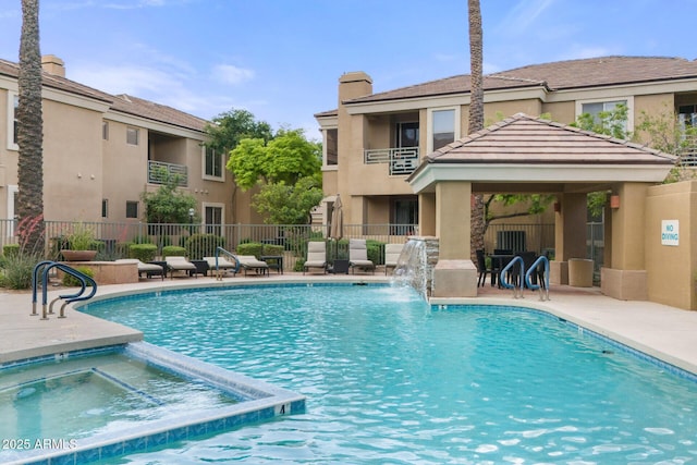 7887 N 16th St Unit 226, Phoenix, AZ 85020 - view of swimming pool featuring fence, a gazebo, a patio, and a pool with connected hot tub
